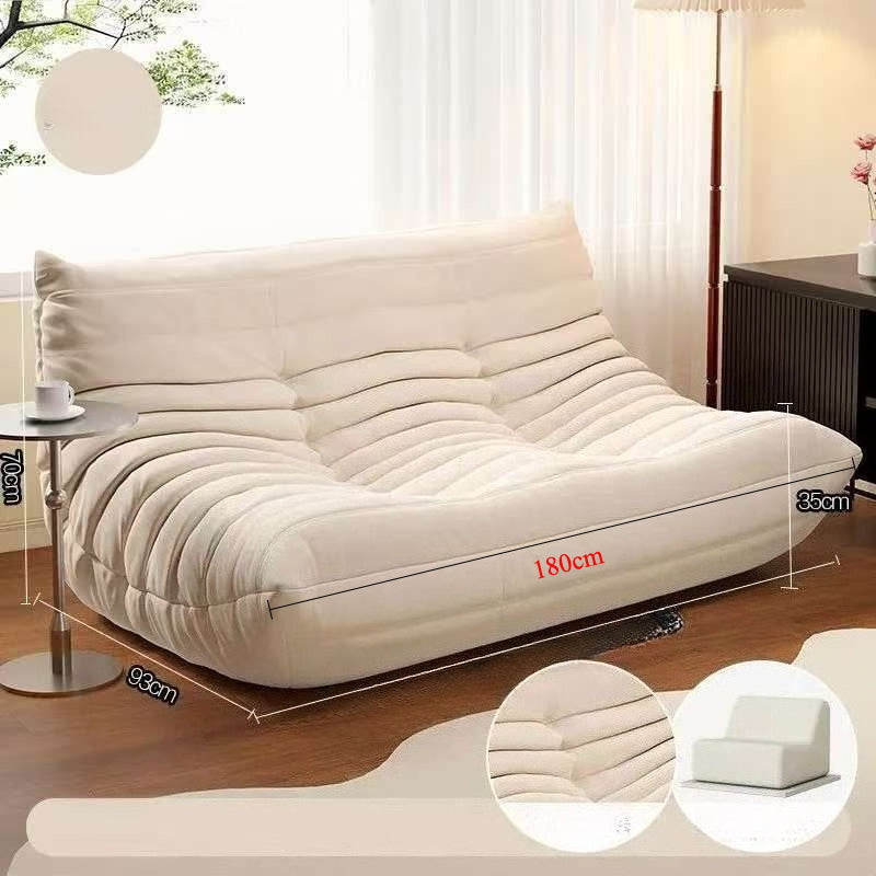 Sofá de pana estilo Togo: líneas suaves y comodidad relajada