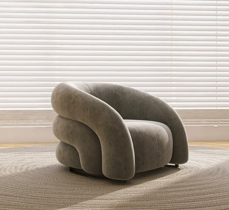 Sillón curvo de tela de diseño: un sofá elegante y cómodo 